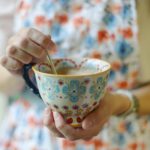 woman holding a tea cup