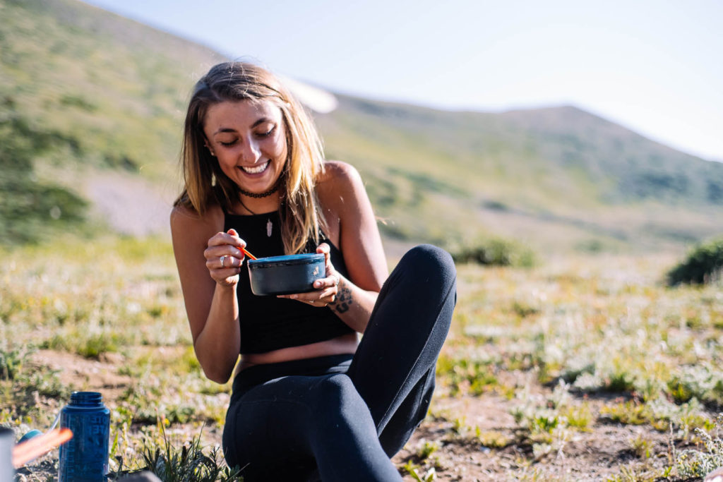 Young girl enjoying food outdoors