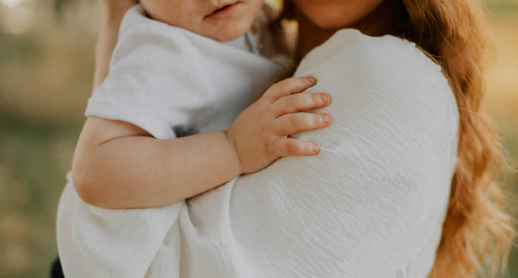 The Advantage of Chiropractic Care from a A young age - Mother holding baby