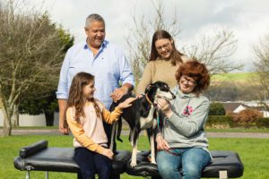 'Pause for a Cause' Photo of Dr. Ben Martin Dr. Jess Crosbie and Aisling Martin of Optimal Chiropractic with Caithriona from D.A.W.G and her rescued pet Katie the Lurcher.