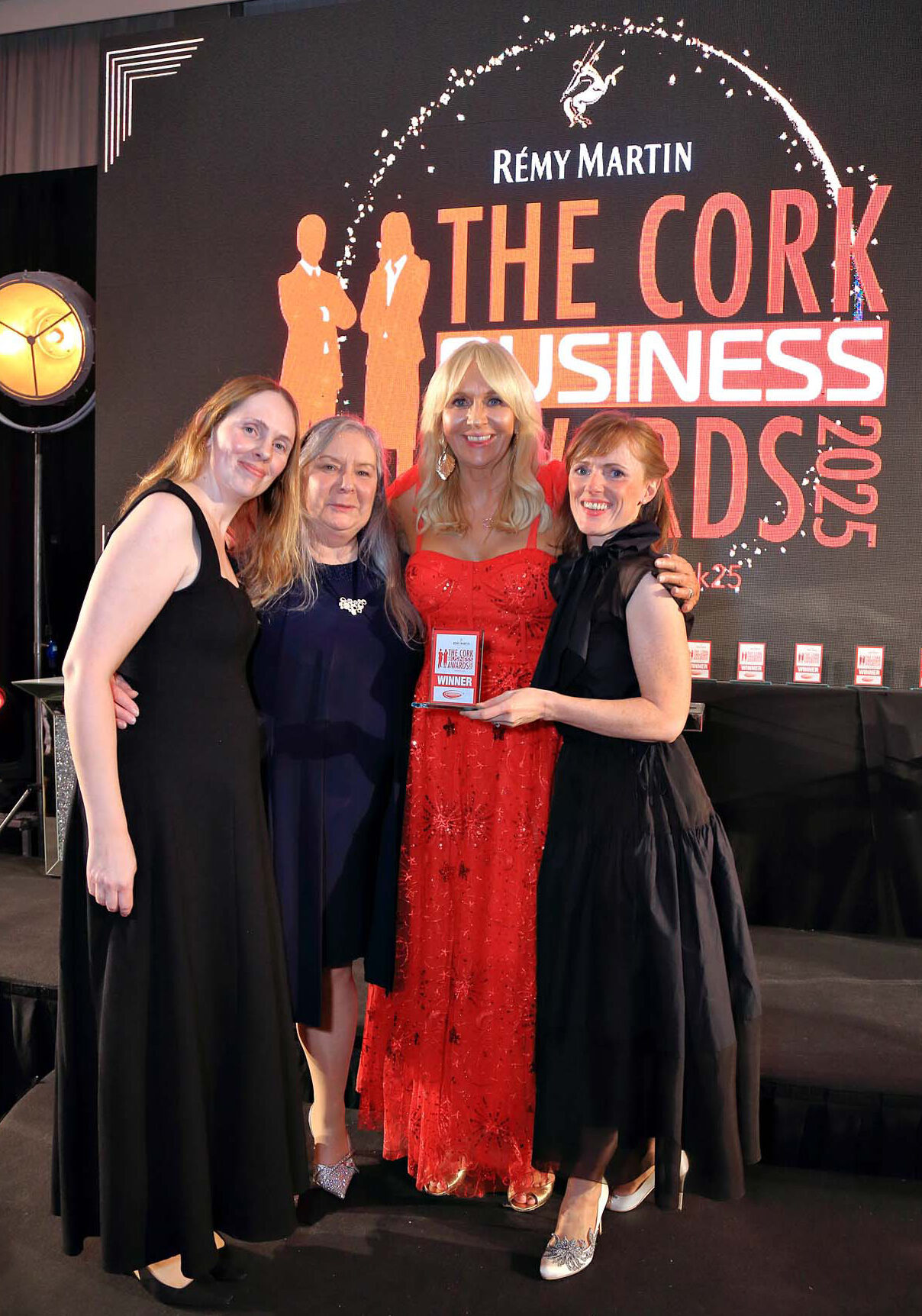 Optimal Chiropractic Team accepting an award from TV Presenter Miriam O'Callaghan for Cork Chiropractic Clinic of the Year